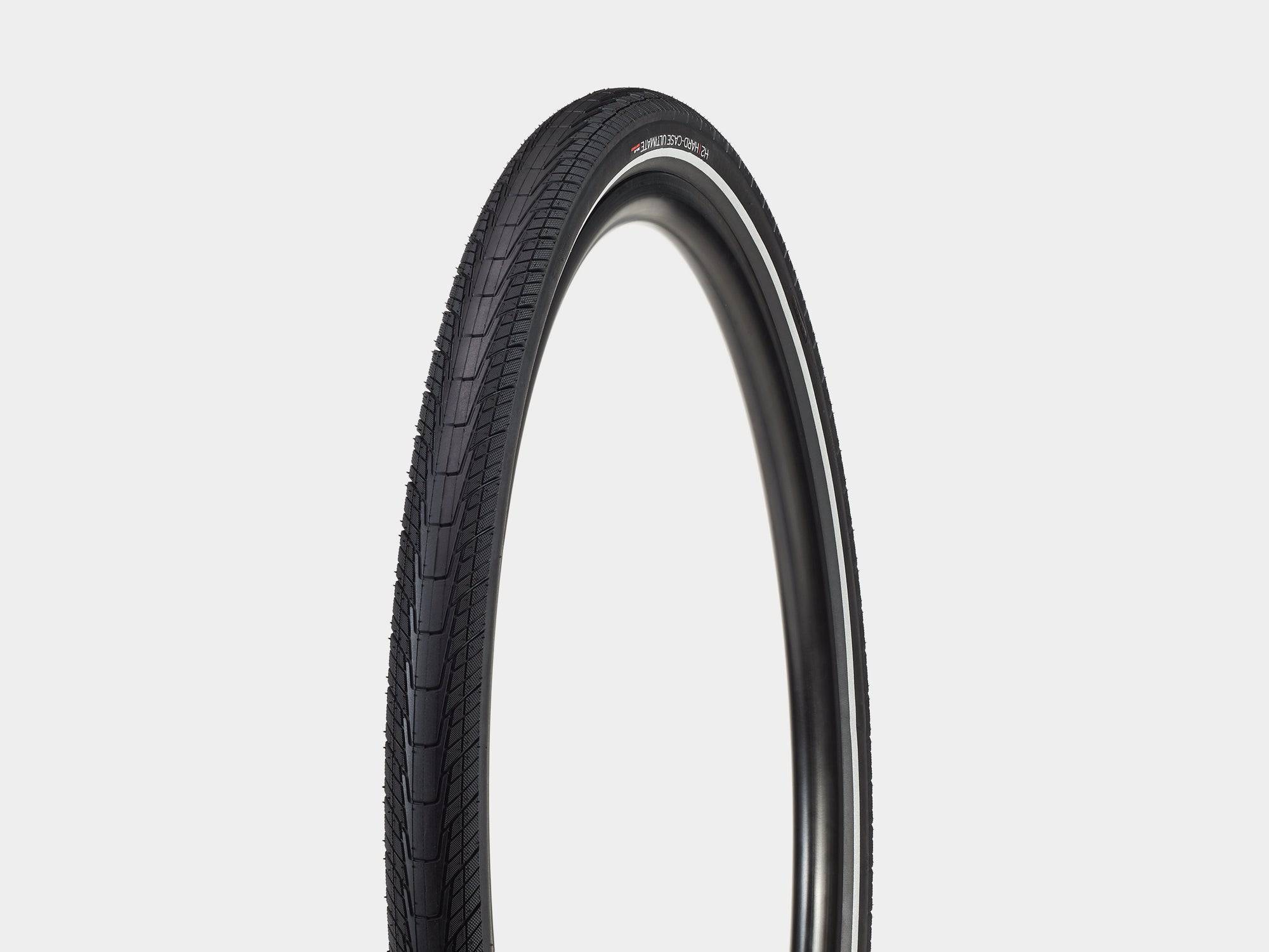 Bontrager H2 Hard-Case Ultimate tire with puncture protection and reflective sidewalls, shown mounted on a bicycle wheel.