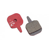 Jagwire Sport semi-metallic disc brake pads for Tektro IO mountain bike, showing the brake pad design and metal backing plate.