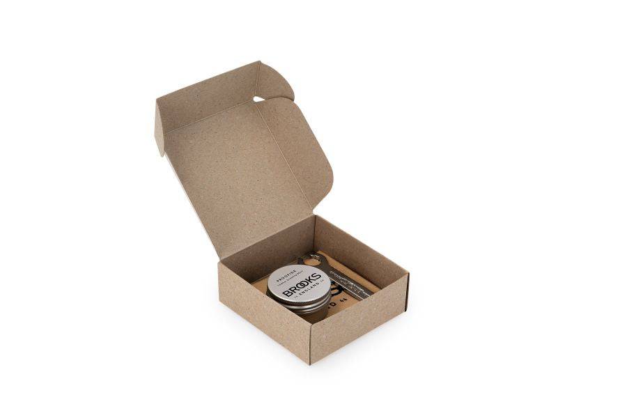 Brooks Leather Saddle Care Kit with Proofide dressing and spanner for leather maintenance and saddle upkeep.