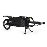 Burley Coho XC cargo bike trailer with suspension and quick release lever, designed for versatile cycling and cargo transport.