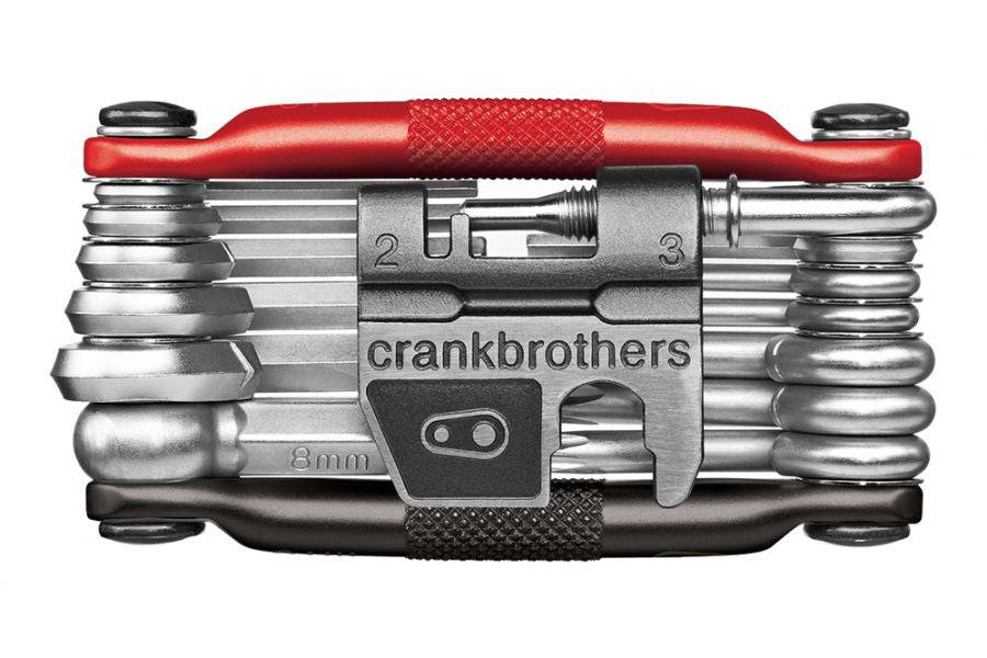 Crankbrothers Multi 19 bike multi-tool in black and red for repair and maintenance, compact workshop kit with various tools laid out.