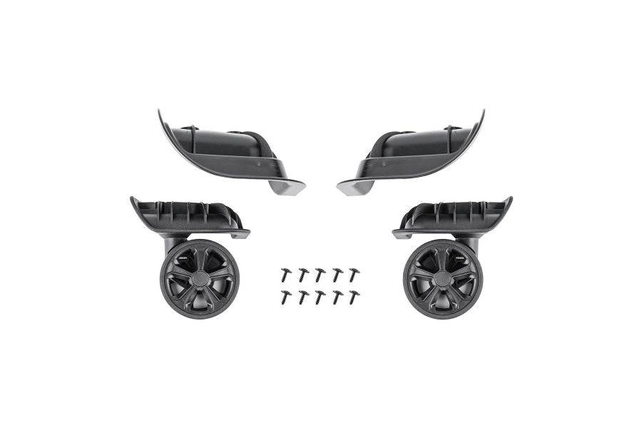 Pair of black Topeak Pakgo X replacement luggage wheels, showing left and right sides with durable, smooth-rolling design.