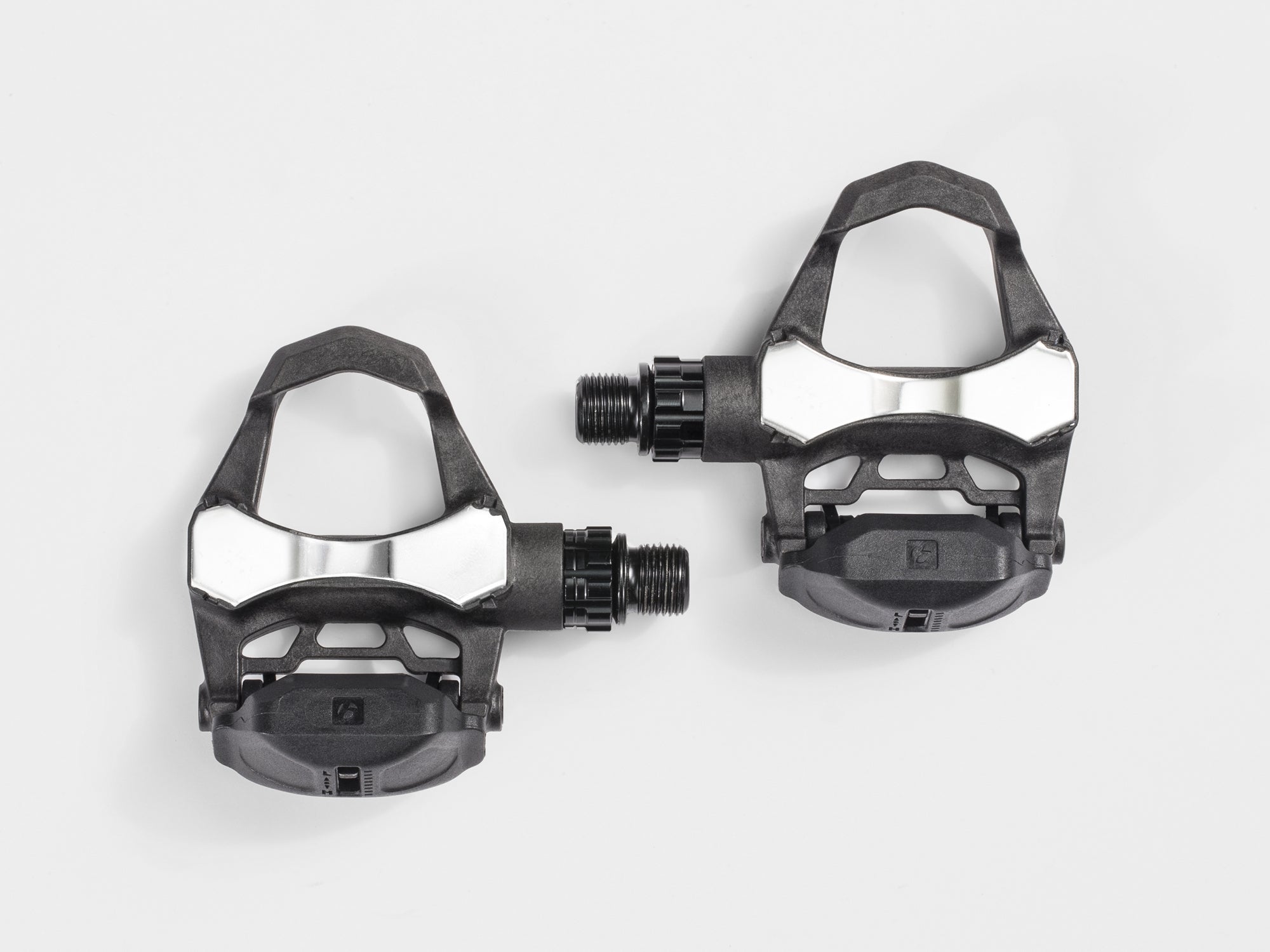 Bontrager Elite road pedal set in black with cleats and adjustable tension, featuring 9/16-inch spindles for cycling components.