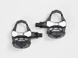 Bontrager Elite road pedal set in black with cleats and adjustable tension, featuring 9/16-inch spindles for cycling components.