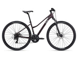 Liv Rove 4 hybrid bike for women with Shimano Tourney drivetrain and disc brakes, suitable for versatile riding.