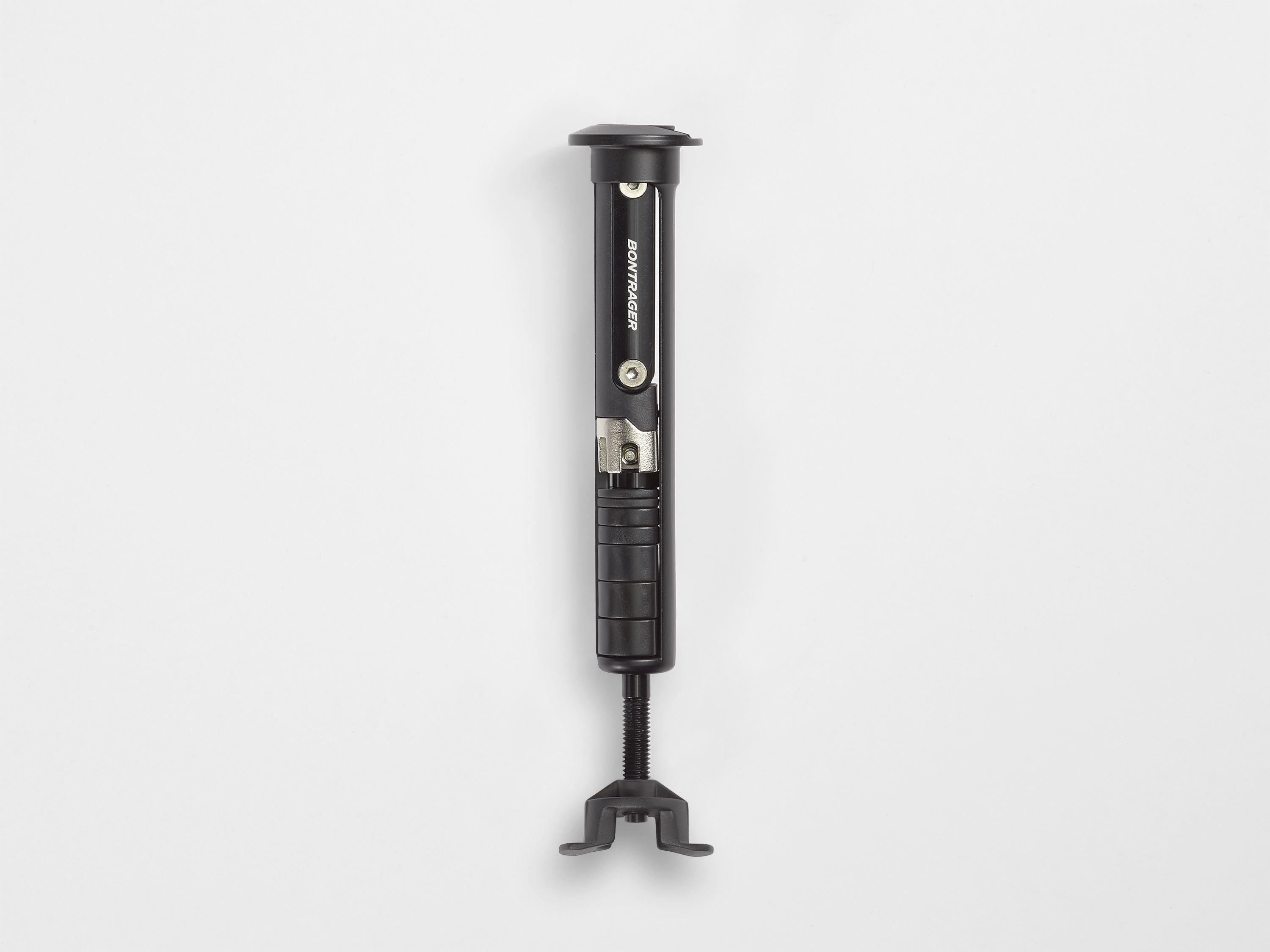 Bontrager BITS integrated MTB multi-tool in black with 10 functions for trail repairs, shown alongside cycling clothing.