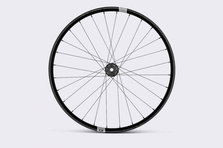 Crank Brothers Synthesis Alloy Enduro MTB front wheel with Industry Nine hub, showing the wheel’s spokes and hub details.