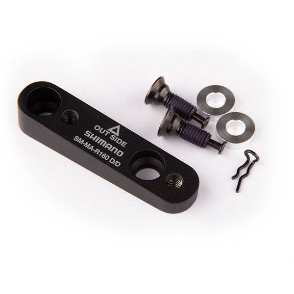 Shimano flat mount disc brake adapter for 160mm rotor, compatible with flat mount frames, shown on a bicycle brake system.