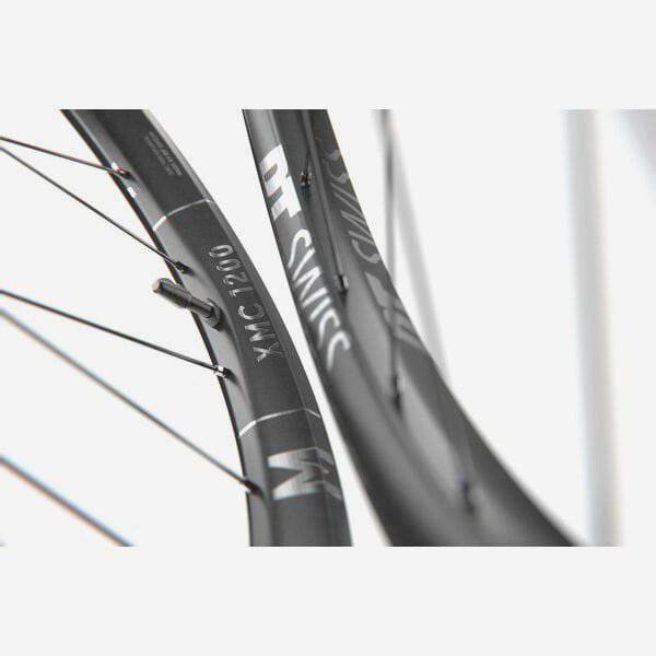 DT Swiss XMC 1200 29-inch rear mountain bike wheel with 30mm carbon rim, BOOST compatibility, MICRO SPLINE/XD hub, mounted on bike.