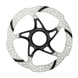 TRP Rotor-25 Centrelock bike rotor with two-piece design and recessed slots, mounted on a bicycle wheel.