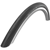 Schwalbe Lugano II road tyre with K-Guard puncture protection and silica compound, shown mounted on a bicycle wheel.