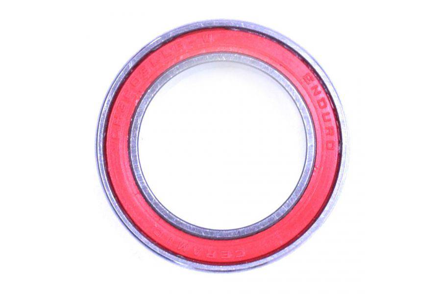 Enduro Bearings 3803 LLB-W ceramic hybrid bearing, 10mm, for bike hubs and bottom brackets, shown in close-up with metal and ceramic components.