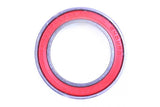 Enduro Bearings 3803 LLB-W ceramic hybrid bearing, 10mm, for bike hubs and bottom brackets, shown in close-up with metal and ceramic components.