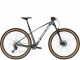 Trek Procaliber 9.5 Gen 3 mountain bike with IsoBow frame technology, showcasing the bike's frame and trail-ready design.