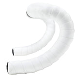 Supacaz Sticky Kush Classic white bar tape with black anodized Star Plugz for bike handlebar components.