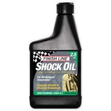 Finish Line Shock Oil 2.5 wt suspension fluid for bicycle forks, 16 oz (475 ml) in a workshop setting.