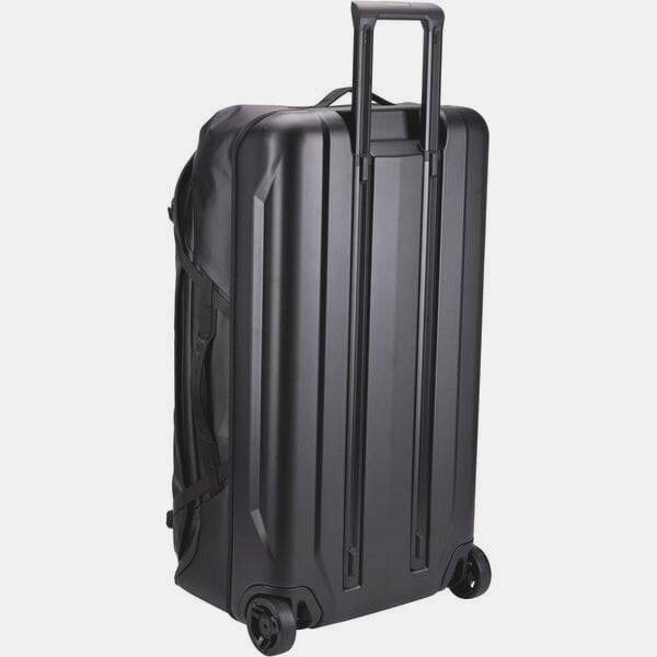 Black Thule Chasm Rolling Duffel Bag showing durable weather-resistant exterior and sturdy wheels for travel accessories.