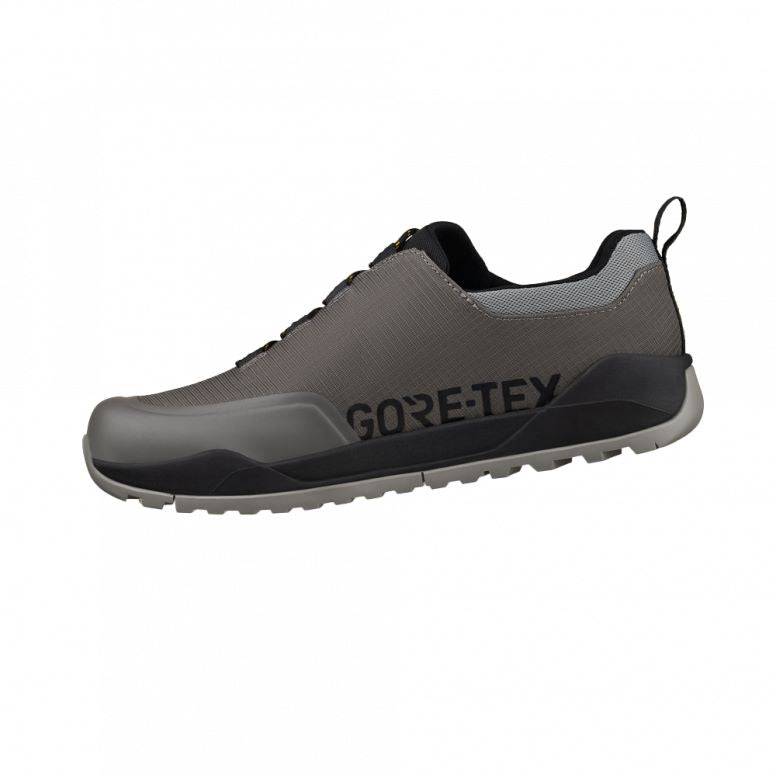 Fizik Terra Ergolace GTX waterproof flat MTB shoes with Vibram outsole, showing the black cycling shoes with rugged tread detail.