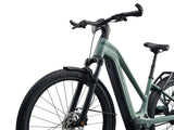 Giant Explore E+ 2 Stagger MY26 electric hybrid bike with SyncDrive Sport2 motor and modern safety features, shown outdoors.