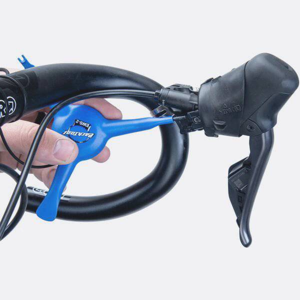 Park Tool EWS-2 electronic wire 3-way tool for Shimano Di2 and SRAM battery covers, designed for workshop use.
