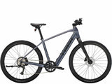 Trek Dual Sport+ 2 LT 2025 electric hybrid bike with black frame, suitable for urban and trail riding.