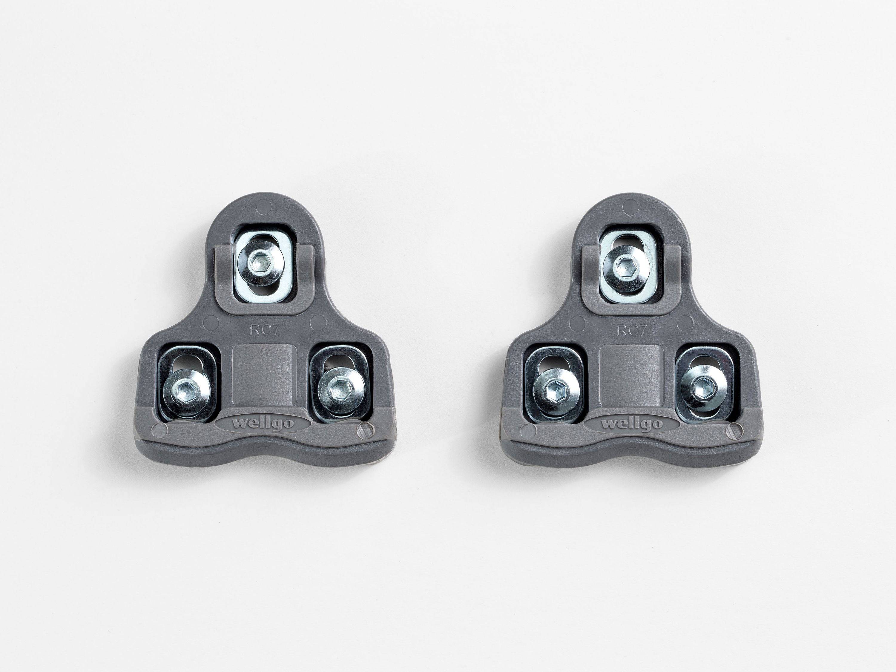 Bontrager grey road clipless pedal cleat set with mounting hardware, designed for bike pedals and cycling performance.