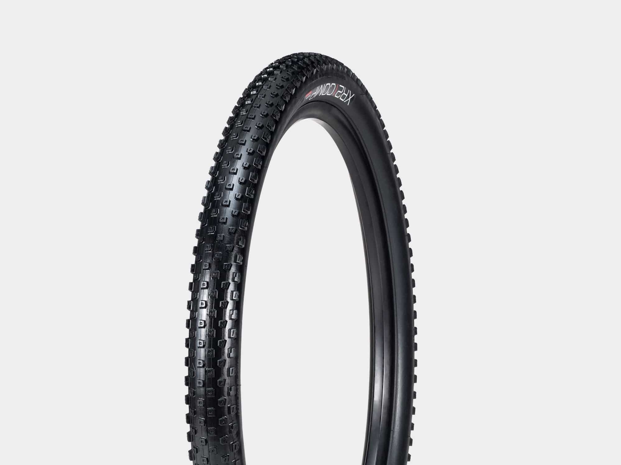 Bontrager XR2 Comp MTB tire tubeless compatible with fast-rolling trail performance, shown mounted on mountain bike wheel.