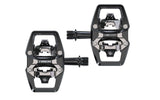 Trek Line Comp Black clipless pedal set with 9/16-inch spindle for cycling shoes, showing the pedals' sleek design and black finish.