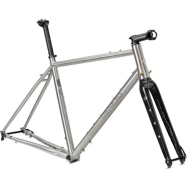 Genesis Croix De Fer Titanium gravel frameset with carbon fork and disc brake mounts, showing sleek frame and fork details.