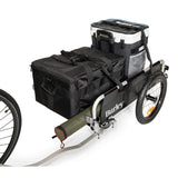 Burley Flatbed Cargo Bike Trailer with foldable two-wheel design, ideal for bulk hauling, shown in a natural outdoor setting