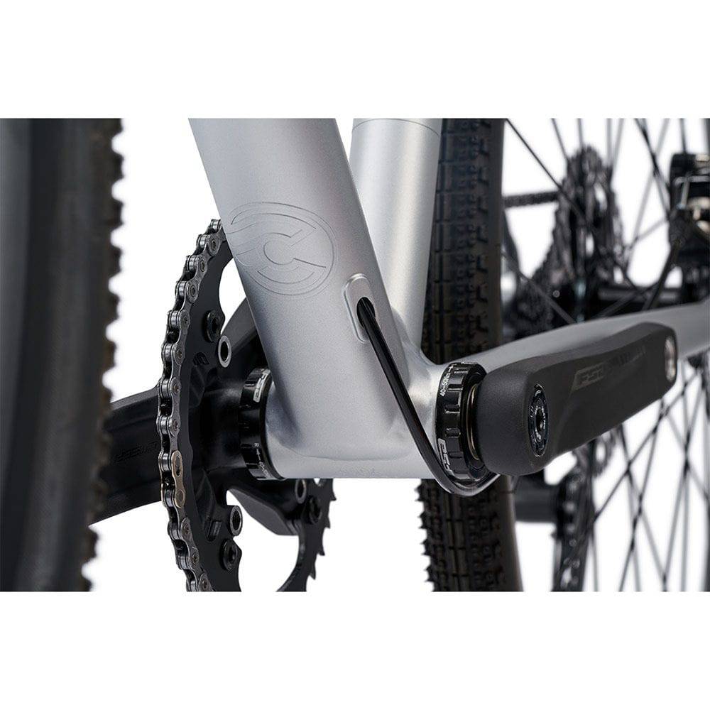 Cinelli Zydeco Silver Bootleg gravel bike with front rack, designed for urban commuting and mixed terrain riding.