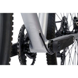 Cinelli Zydeco Silver Bootleg gravel bike with front rack, designed for urban commuting and mixed terrain riding.