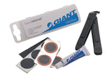 Giant bicycle tyre patch kit with accessories for quick inner tube repairs, including patches and tools for bike maintenance.