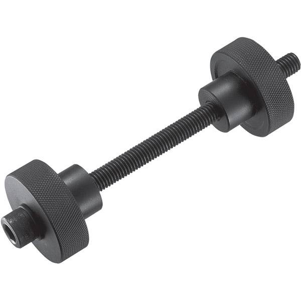 Shimano TL-BB12 press-fit bottom bracket installation tool for workshop use, with black handle and metal components.