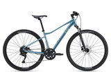 Liv Rove 2 2024 women's hybrid bike with Shimano drivetrain and disc brakes, featuring a sleek frame and all-terrain tires.