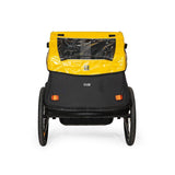 Burley Rental Cub Child Bike Trailer with weather protection, designed for high-frequency rental use, shown with secure attachment and canopy