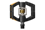 Crankbrothers Mallet E 11 enduro pedals in black and gold with adjustable pins, durable mountain biking components.