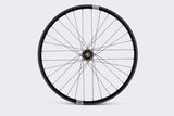 Crank Brothers Synthesis Alloy rear e-bike wheel with 27.5/29-inch tires, durable mountain bike components.