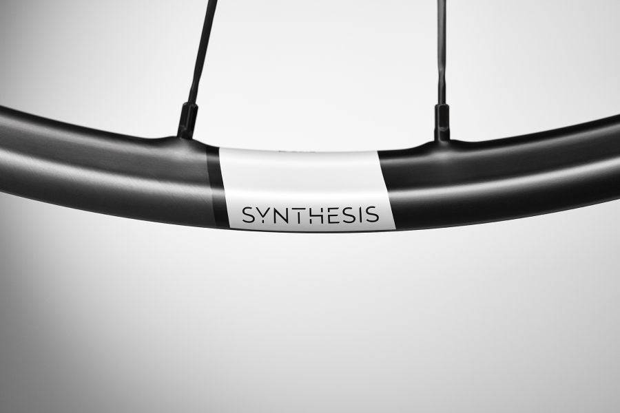Crank Brothers Synthesis Carbon E-Bike mountain bike wheels with sleek black rims and disc brakes for trail riding.