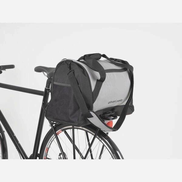AtranVelo PULSE AVS 36L Duffle Bag in black with reflective details and AVS mounting system, designed for cycling accessories.