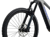 Giant Reign Advanced E+ 2 2026 e-Mountain Bike with SyncDrive Pro 3 motor, showing the bike's frame and mountain trail.