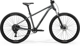 Merida Big Nine 20 MY26 aluminium hardtail mountain bike with disc brakes, shown from the side on rugged terrain.