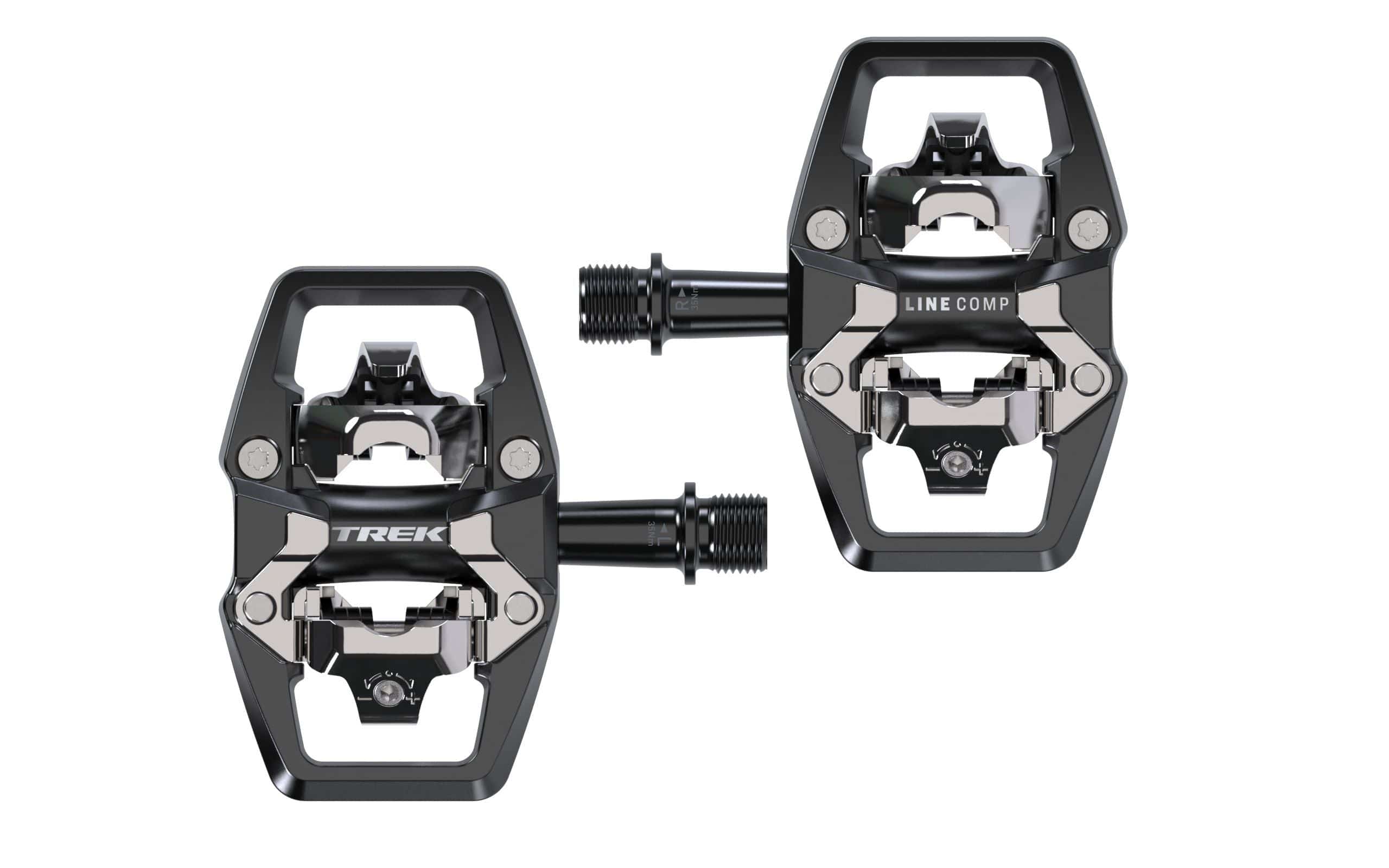 Trek Line Comp Black clipless pedal set with 9/16 inch spindle for cycling shoes, mounted on a bike pedal platform.