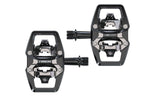 Trek Line Comp Black clipless pedal set with 9/16 inch spindle for cycling shoes, mounted on a bike pedal platform.