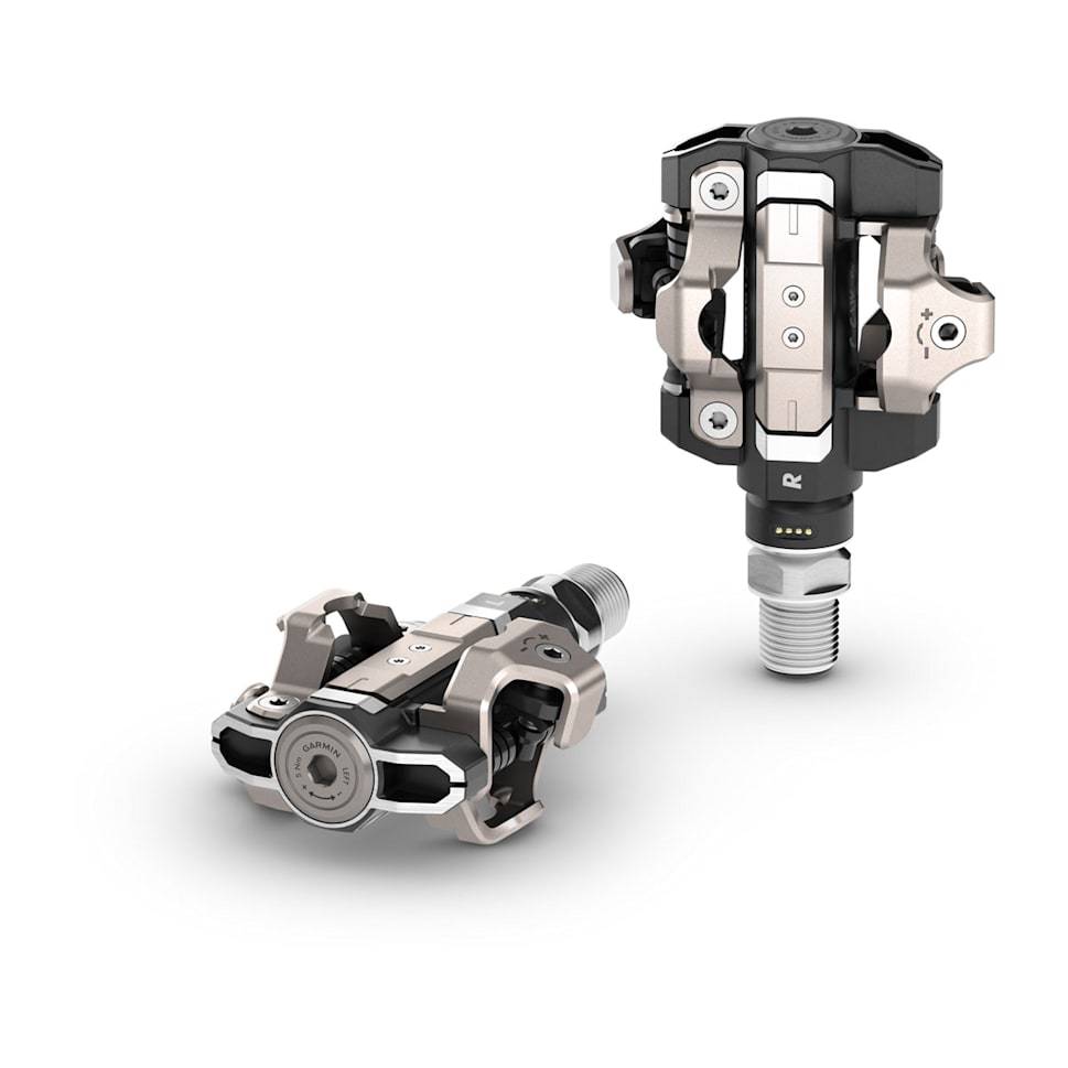 Garmin Rally RK/XC210 dual-sensing power meter pedal bundle for road and mountain biking, showing pedals on a bike.