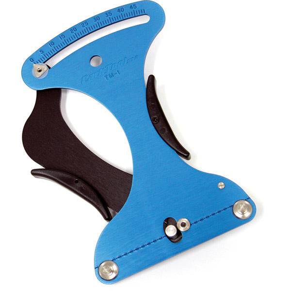 Park Tool TM-1 spoke tension meter used for accurate wheel building and repair in workshop settings.