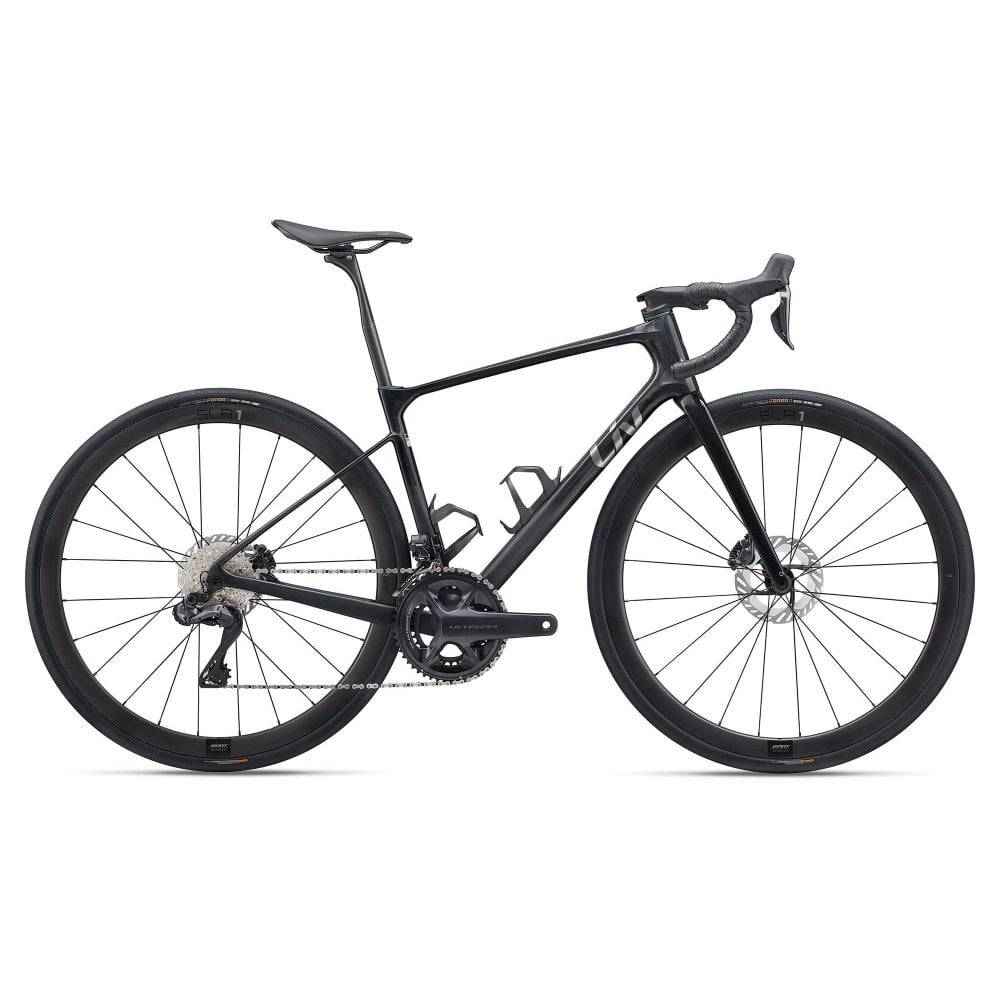 Liv Devote Advanced 1 2025 gravel bike with disc brakes, featuring a sleek frame, drop handlebars, and knobby tires for versatile riding.