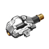 Look X-One-G Ti gravel racing pedals with SPD compatibility and adjustable tension, featuring lightweight titanium construction.