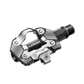 Look X-One-G Max gravel bike pedals with SPD compatibility, single-sided design, black metal body and cleat engagement mechanism.
