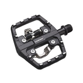 Look X-Venture Plus dual-sided pedals with SPD clipless and flat platform for cycling, shown with cleats attached.